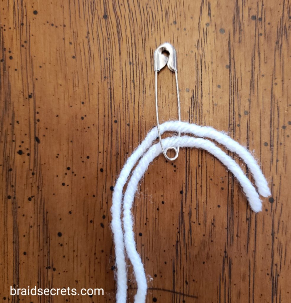 Horse Braiding Hacks: Use a safety pin to pull up braids in a pinch.